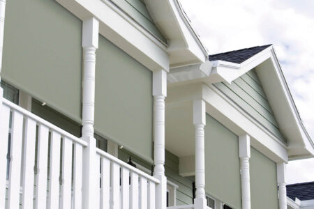 Traditional styled home patio featuring Straight Drop Awnings, available at our Complete Blinds Brisbane Showroom.