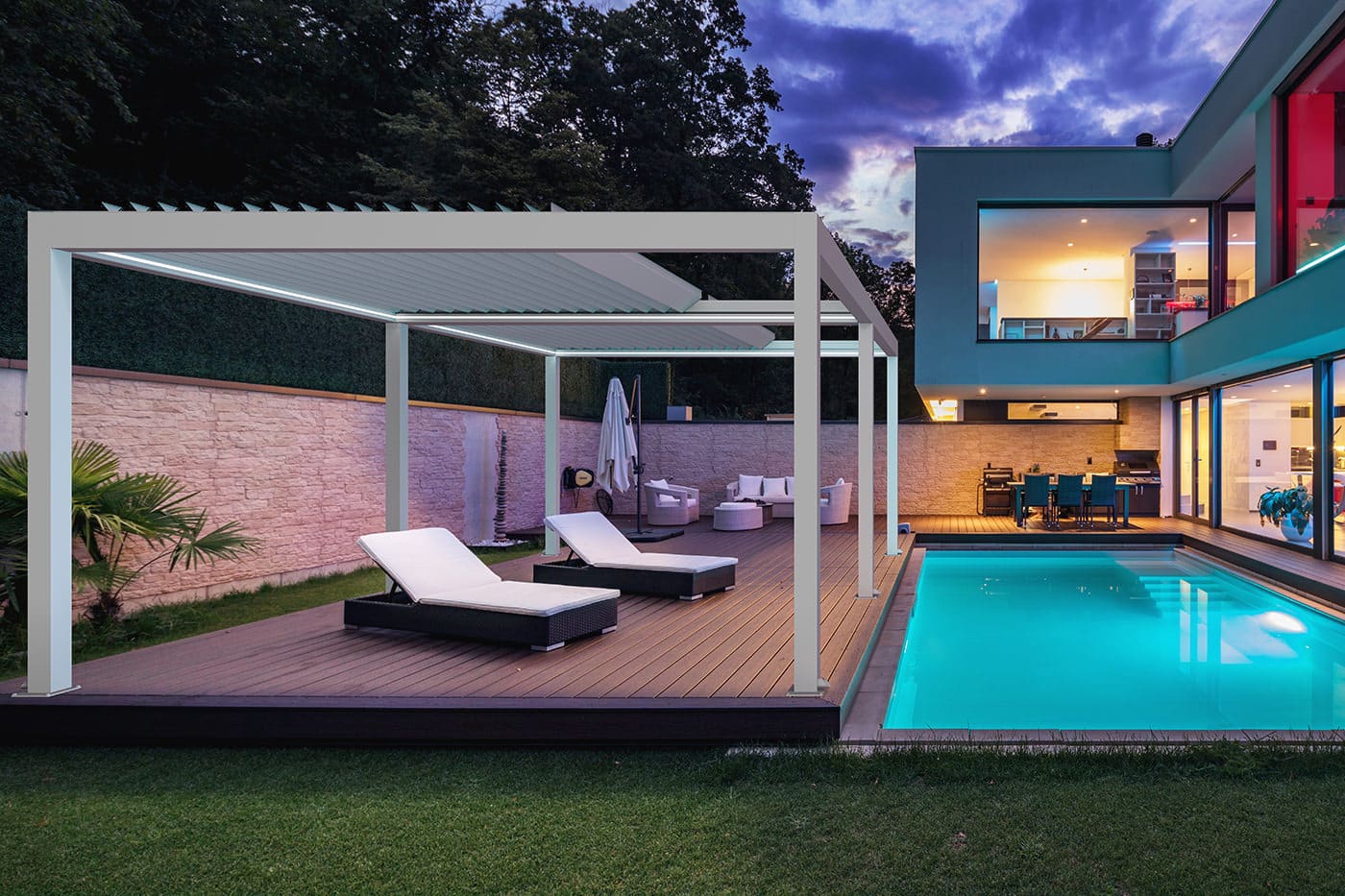 Retractable Louvre Roof Pergola-8 A modern and luxurious home patio with swimming pool featuring Retractable Louvre Roof Pergola Awnings by Complete Blinds Brisbane.