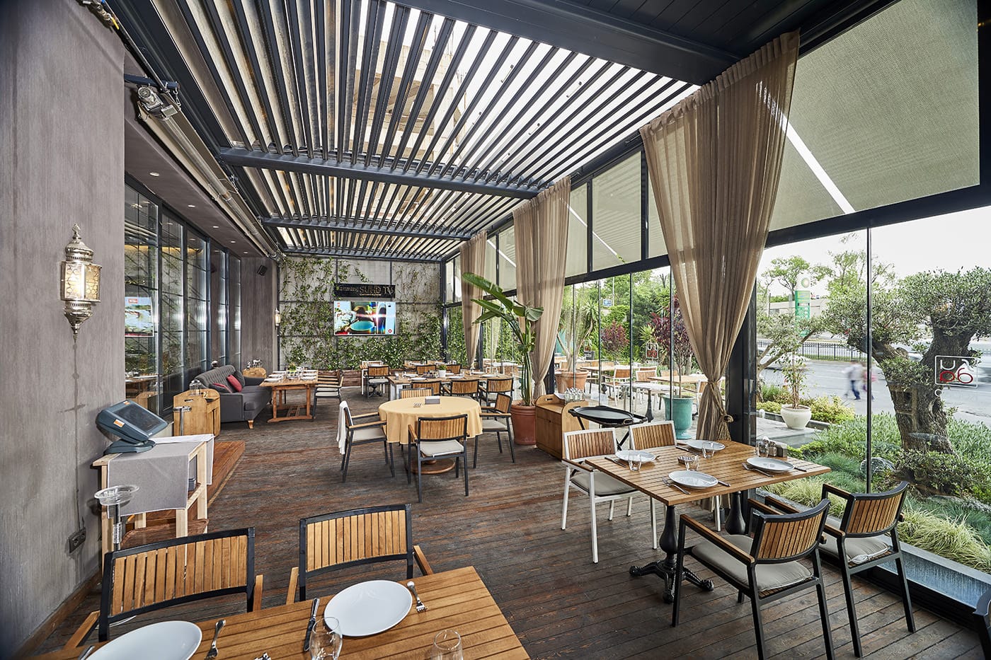 Retractable Louvre Roof Pergola A fancy and contemporary restaurant featuring Retractable Louvre Roof Pergola Awnings by Complete Blinds Brisbane.