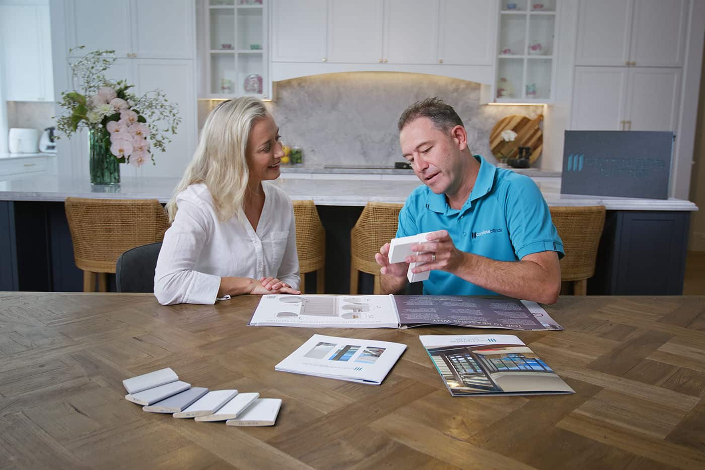 Consultation-shutters-2 Client consulting Blinds Specialists from Complete Blinds Brisbane.
